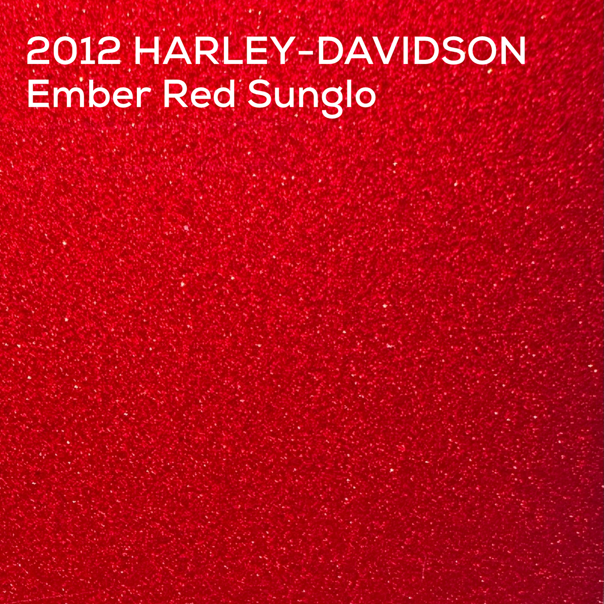 A close-up textured color swatch of a red glittery or sparkly material with white text at the top reading '2012 HARLEY-DAVIDSON Ember Red Sunglo'.