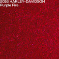 A close-up textured paint swatch of red glittery paint with small purple sparkles, labeled at the top left as '2016 HARLEY-DAVIDSON Purple Fire'.