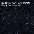 A dark metallic textured surface labeled '2021 HARLEY-DAVIDSON Black Jack Metallic' in white text at the top, showing a black-to-charcoal reflective speckled finish.