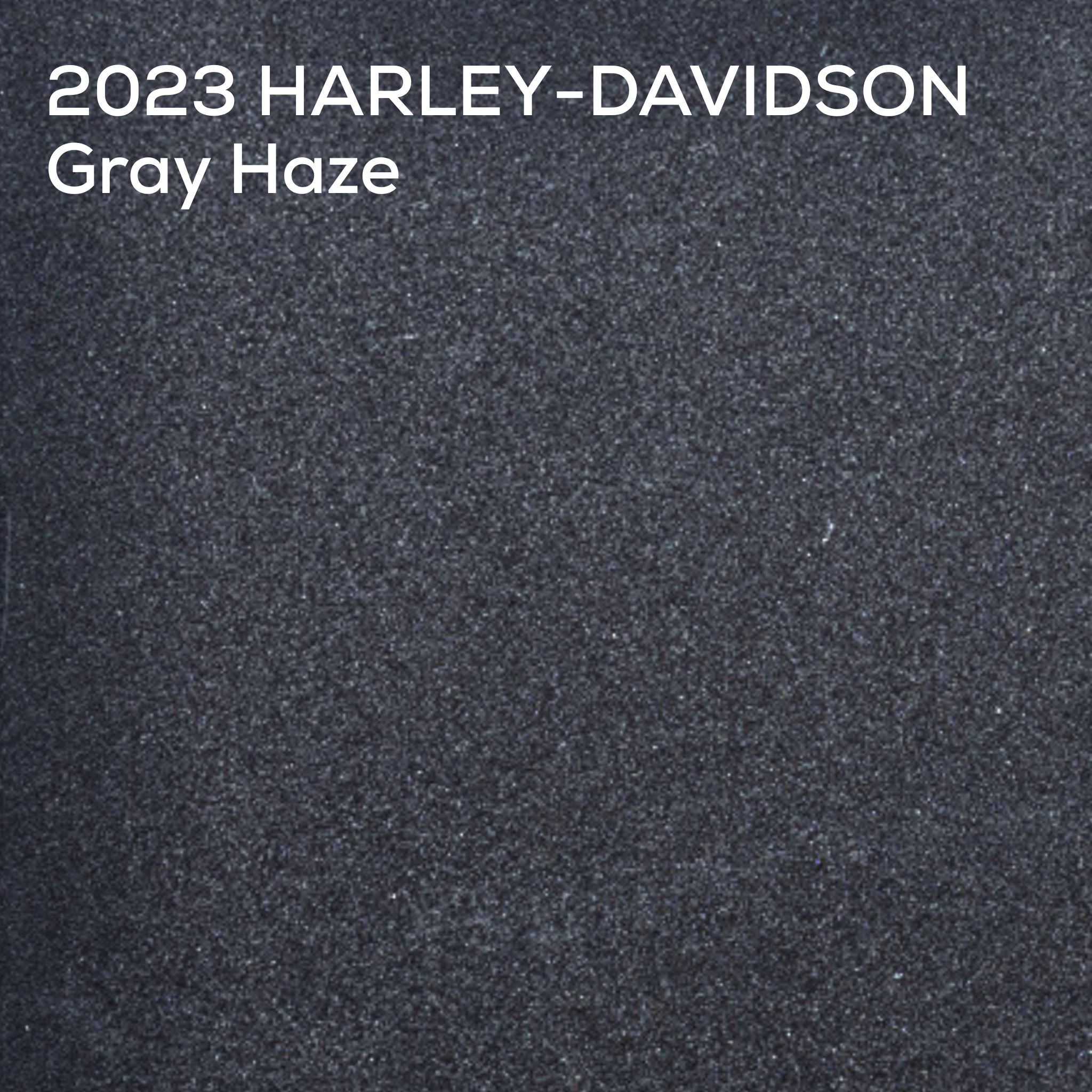 A textured color swatch labeled '2023 HARLEY-DAVIDSON Gray Haze' in white text at the top, showing a dark charcoal gray painted surface.